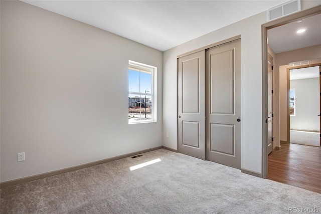 24593 E 34th Ave, Aurora, CO 80019 - unfurnished bedroom with carpet flooring, baseboards, and a closet