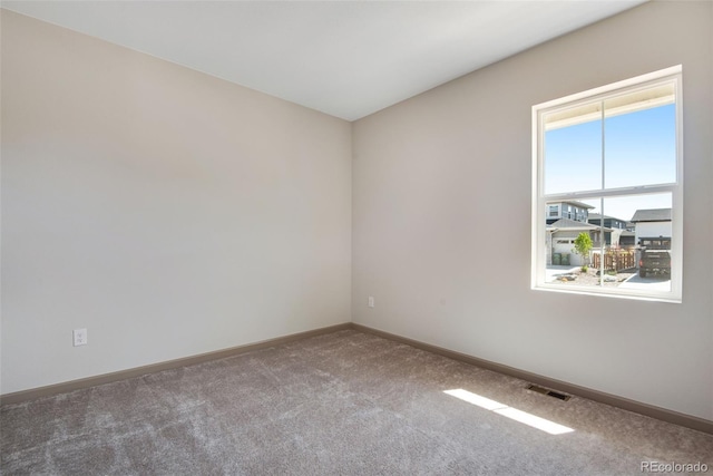 24593 E 34th Ave, Aurora, CO 80019 - empty room featuring carpet flooring and baseboards