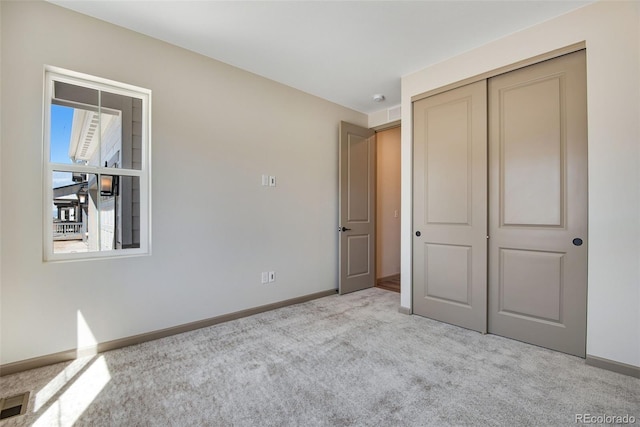 24593 E 34th Ave, Aurora, CO 80019 - unfurnished bedroom with carpet, baseboards, and a closet