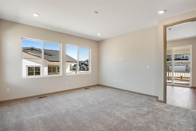 24593 E 34th Ave, Aurora, CO 80019 - carpeted empty room with baseboards and recessed lighting