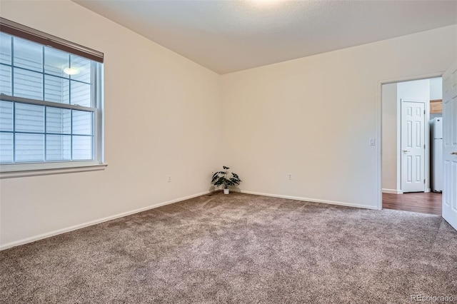 7831 S Addison Way, Aurora, CO 80016 - empty room with dark carpet and baseboards