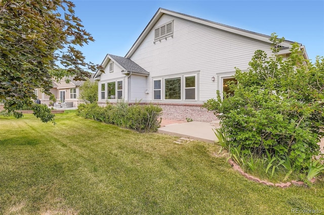 7831 S Addison Way, Aurora, CO 80016 - back of property with a yard and a patio area