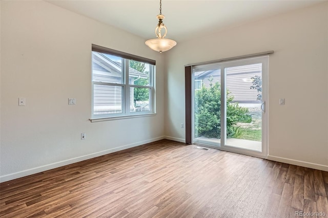 7831 S Addison Way, Aurora, CO 80016 - spare room with wood finished floors and baseboards