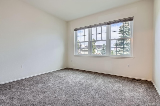 7831 S Addison Way, Aurora, CO 80016 - spare room featuring carpet