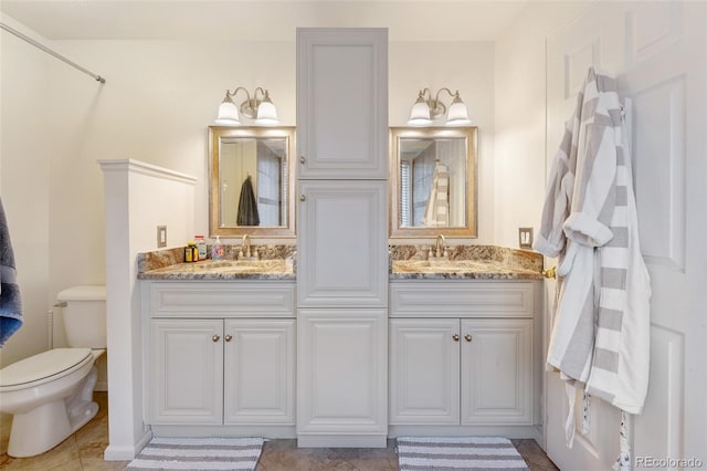 bathroom with vanity and toilet