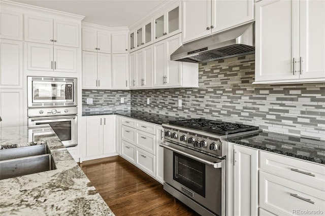 kitchen with under cabinet range hood, white cabinetry, and stainless steel appliances