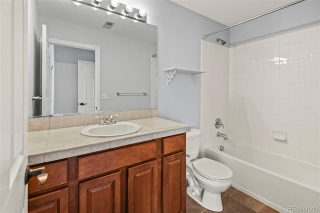 full bathroom featuring visible vents, toilet, bathtub / shower combination, vanity, and tile patterned floors