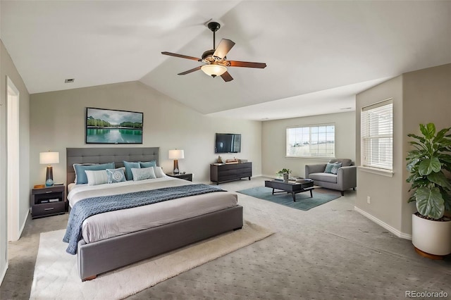 bedroom featuring baseboards, vaulted ceiling, a ceiling fan, visible vents, and light colored carpet