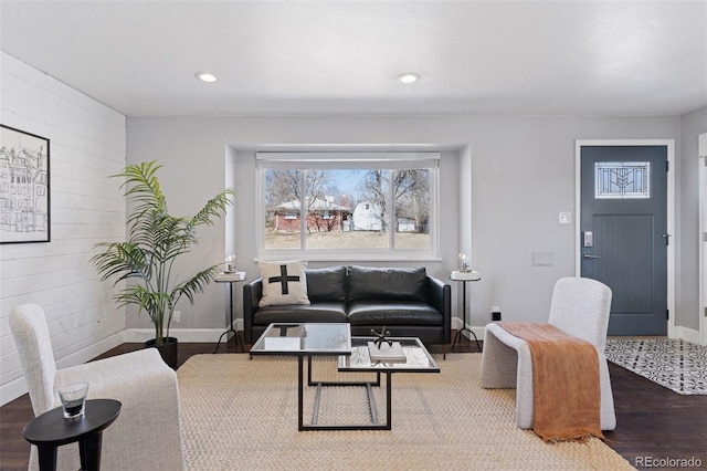 living area featuring recessed lighting, wood finished floors, and baseboards