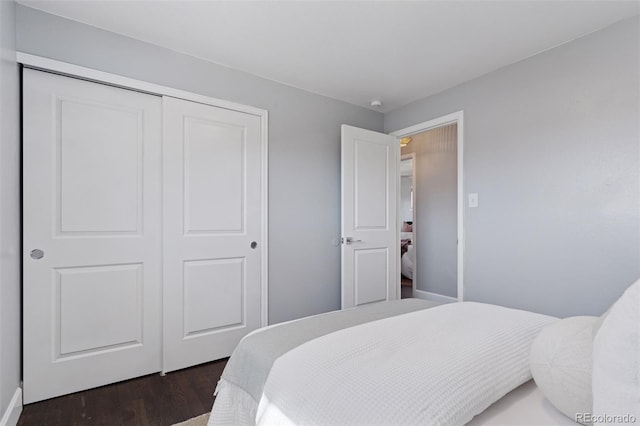 bedroom featuring a closet and wood finished floors