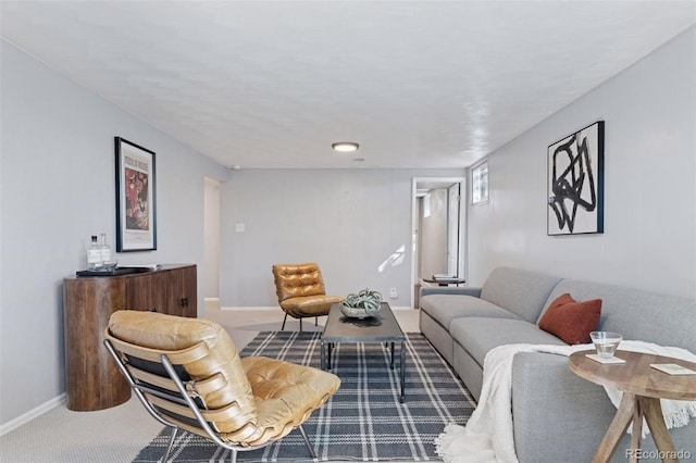 carpeted living room featuring baseboards