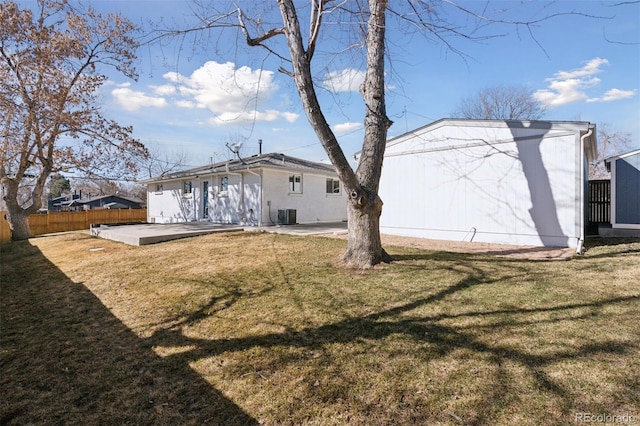 back of property featuring central AC, fence, a patio, and a yard