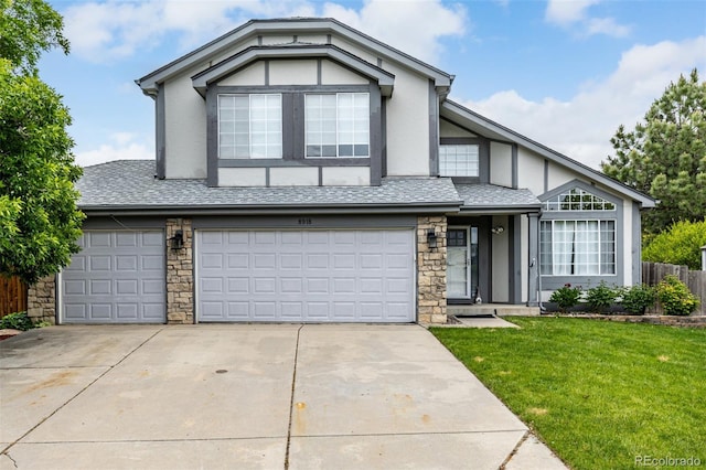 8918 W 101st Ave, Broomfield, CO 80021 - view of front facade featuring stone siding, driveway, stucco siding, and an attached garage