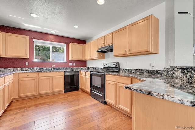18947 E 57th Pl, Denver, CO 80249 - kitchen with black appliances, light brown cabinetry, under cabinet range hood, light wood finished floors, and a textured ceiling