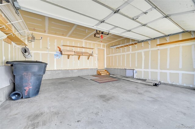 18947 E 57th Pl, Denver, CO 80249 - garage featuring a garage door opener