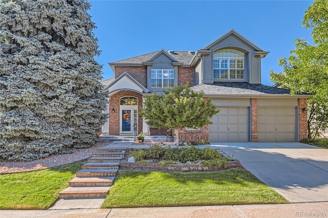 front facade with a garage and a front yard