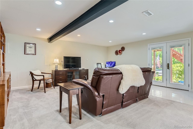 carpeted living room featuring french doors and beamed ceiling