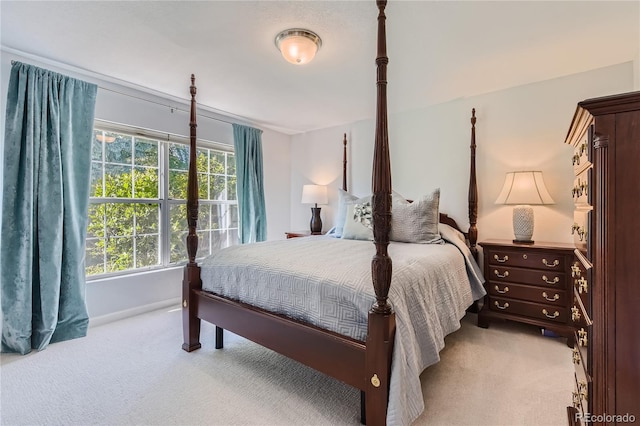 bedroom featuring light colored carpet