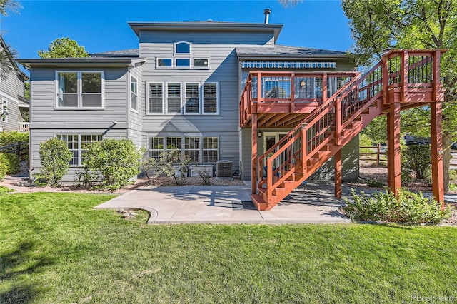 back of property featuring a yard, a patio area, central air condition unit, and a deck