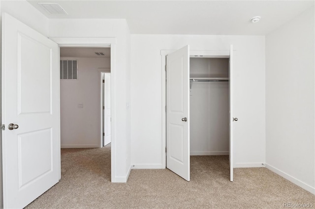 27424 E Byers Ave, Aurora, CO 80018 - unfurnished bedroom with light colored carpet and a closet