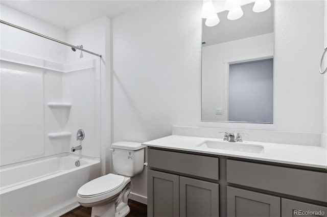 27424 E Byers Ave, Aurora, CO 80018 - bathroom featuring vanity, washtub / shower combination, and wood finished floors