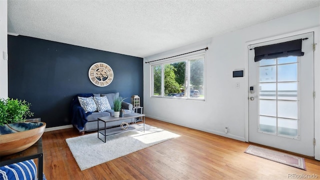 1930 S Prospect Ave, Colorado Springs, CO 80905 - sitting room featuring wood finished floors, a textured ceiling, and baseboards