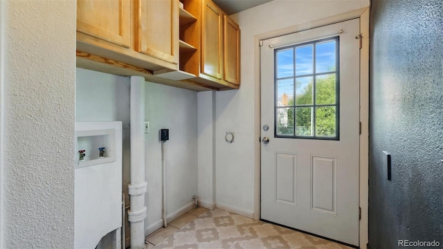 1930 S Prospect Ave, Colorado Springs, CO 80905 - laundry area featuring washer hookup and cabinet space
