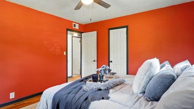 1930 S Prospect Ave, Colorado Springs, CO 80905 - bedroom featuring wood finished floors, ceiling fan, a textured ceiling, and baseboards