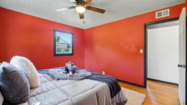 1930 S Prospect Ave, Colorado Springs, CO 80905 - bedroom featuring wood finished floors, a textured ceiling, ceiling fan, and baseboards
