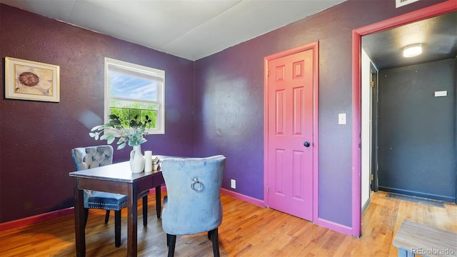 1930 S Prospect Ave, Colorado Springs, CO 80905 - dining area featuring light wood-type flooring, baseboards, and a textured wall