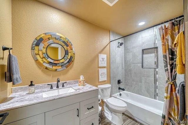 full bathroom with vanity, toilet, and shower / bath combo with shower curtain