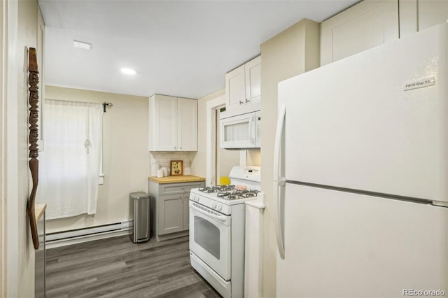 kitchen with dark wood-style floors, tasteful backsplash, light countertops, baseboard heating, and white appliances