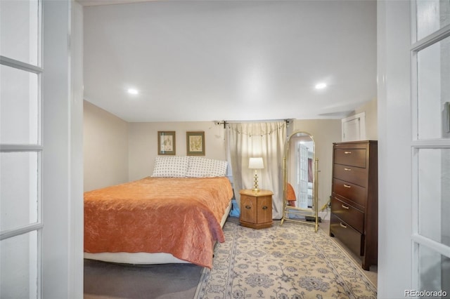 bedroom with recessed lighting and light colored carpet