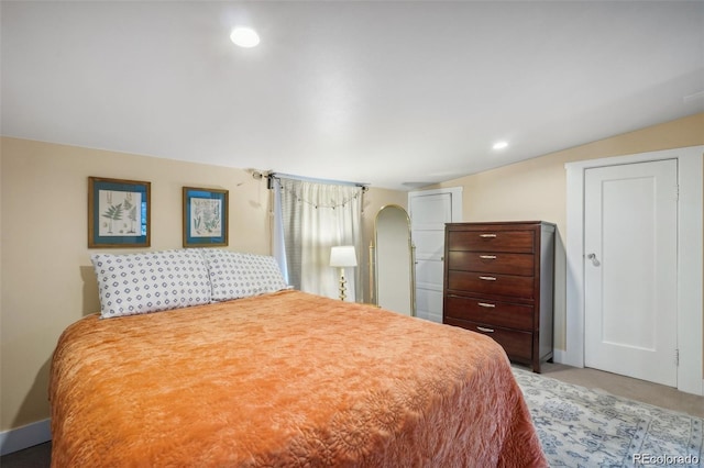 bedroom featuring arched walkways, recessed lighting, and baseboards