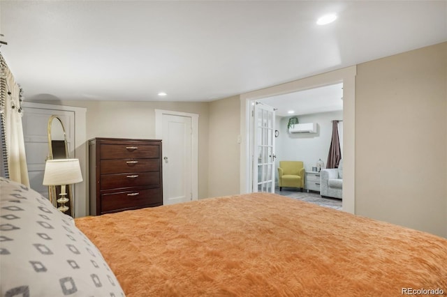 bedroom featuring an AC wall unit and recessed lighting