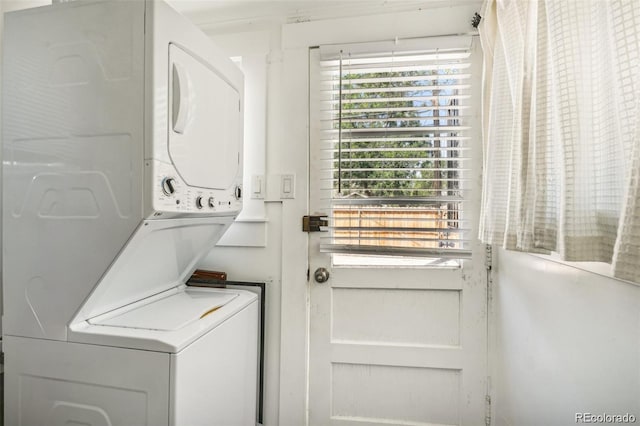 laundry area featuring laundry area and stacked washer and clothes dryer