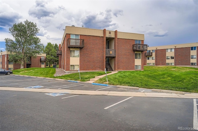 3643 S Sheridan Blvd Unit 12, Denver, CO 80235 - view of property featuring uncovered parking
