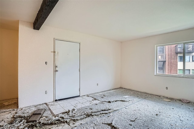 3643 S Sheridan Blvd Unit 12, Denver, CO 80235 - unfurnished room featuring beam ceiling