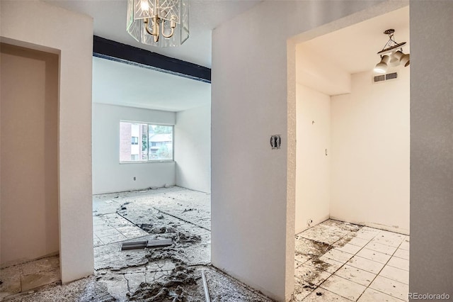 3643 S Sheridan Blvd Unit 12, Denver, CO 80235 - hallway with a chandelier