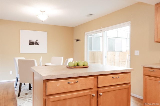 654 S Xenon Ct, Lakewood, CO 80228 - kitchen with light wood-type flooring and light countertops