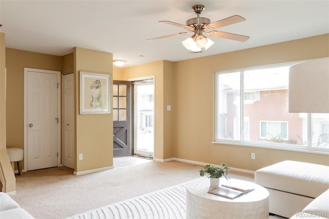 654 S Xenon Ct, Lakewood, CO 80228 - living room featuring light carpet and ceiling fan