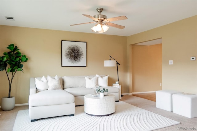 654 S Xenon Ct, Lakewood, CO 80228 - carpeted living room with ceiling fan and baseboards