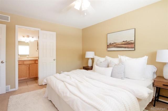 654 S Xenon Ct, Lakewood, CO 80228 - bedroom featuring light colored carpet, ensuite bath, and ceiling fan