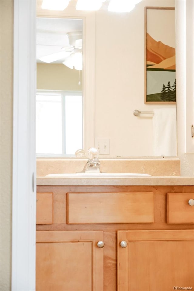 654 S Xenon Ct, Lakewood, CO 80228 - bathroom featuring vanity and ceiling fan