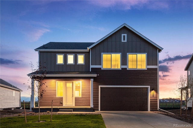 view of front facade with a garage and a lawn