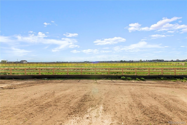 view of yard with a rural view