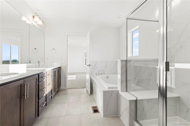 bathroom featuring tile patterned flooring, vanity, and independent shower and bath