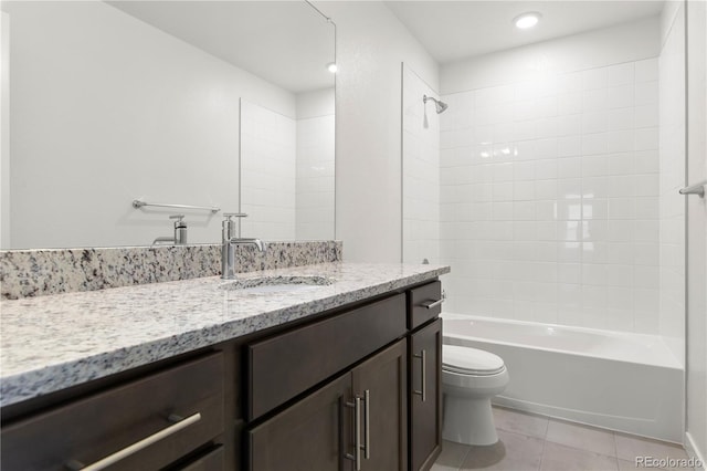 full bathroom with tile patterned flooring, vanity, toilet, and tiled shower / bath combo