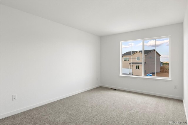 view of carpeted spare room