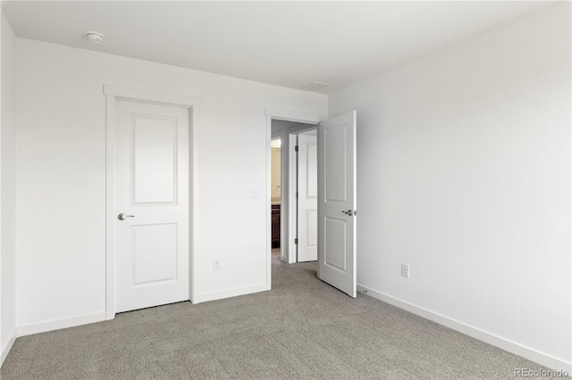 unfurnished bedroom featuring carpet floors